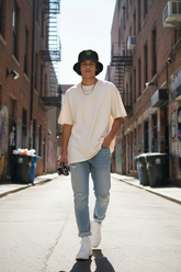 Model wearing bucket hat